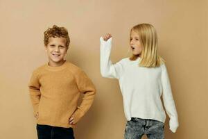 Boy and girl gesticulate with their hands together Lifestyle unaltered photo