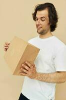 man paper grocery bag posing isolated background photo