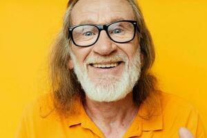 cheerful elderly man with glasses gray beard close-up photo
