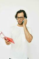 handsome man red notepad telephone communication Lifestyle unaltered photo