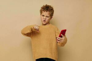 little boy with curly hair red phone technology fun photo