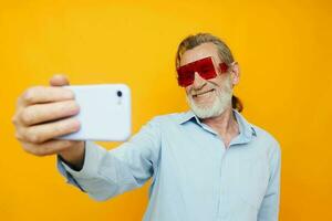 elderly man fashion red glasses phone selfie technology photo
