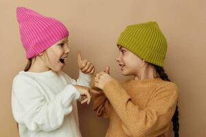 smiling little girls in hats studio childhood photo