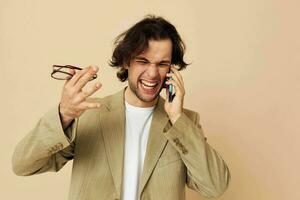 man in a suit posing emotions talking on the phone Lifestyle unaltered photo