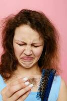 teenager girl dislike comb on hair emotion isolated background unaltered photo