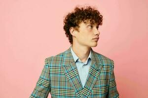 cute red-haired guy gesturing with his hands emotions checkered jacket isolated background unaltered photo