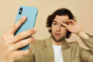 Attractive man takes a selfie classic style technologies isolated background photo