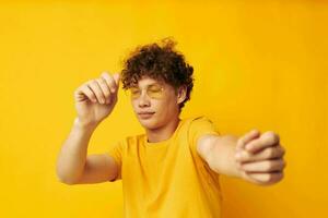 cute red-haired guy wearing stylish glasses yellow t-shirt posing monochrome shot photo