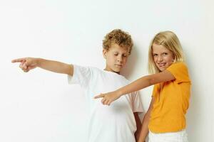 Boy and girl fun gestures with hands emotions childhood lifestyle unaltered photo