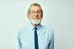 elderly man with gray beard in business office suit photo