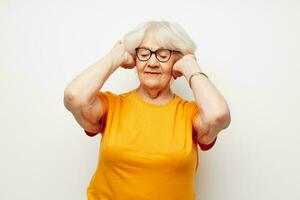 Photo of retired old lady health lifestyle eyeglasses treatment light background