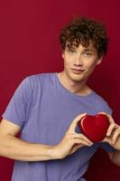 cute red-haired guy heart in hands gift romance photo