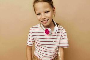 Portrait of happy smiling child girl headphones entertainment emotions Lifestyle unaltered photo