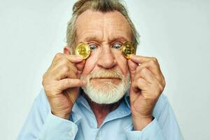 Portrait elderly man cryptocurrency bitcoin face close up investment unaltered photo