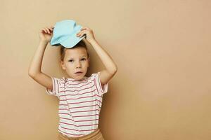 Portrait of happy smiling child girl posing baby clothes fun Lifestyle unaltered photo