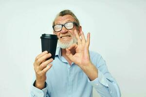 Portrait elderly man with glasses and shirts disposable glass isolated background photo