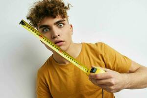 handsome young man emotions posing close-up light background photo