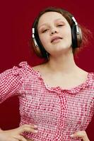 emotional girl in green shorts with headphones listening to music unaltered photo