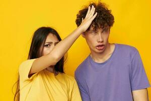 teenagers in colorful t-shirts posing friendship fun isolated background unaltered photo