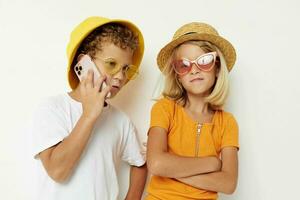boy and girl with phone entertainment technology childhood photo