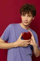 cute curly guy in purple t-shirt heart shaped box gift photo