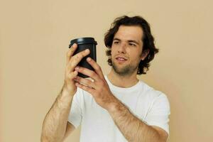 handsome man with a black glass in a white t-shirt isolated background photo