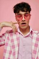 Photo of romantic young boyfriend fashionable pink sunglasses jacket posing model studio