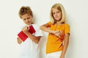 two joyful children draw in the notebook childhood entertainment color background unaltered photo