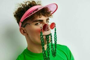 handsome young man stylish glasses cap close-up isolated background photo