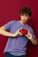 cute red-haired guy heart in hands gift romance photo