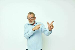 old man in shirt and glasses posing emotions light background photo