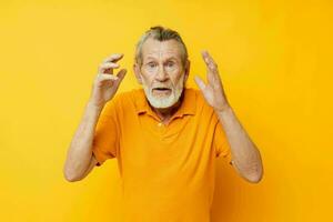 Portrait elderly man with a gray beard emotion gestures hands cropped view photo