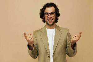 handsome man with glasses emotions gesture hands posing beige background photo