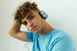 handsome young man in blue t-shirts headphones fashion Lifestyle unaltered photo