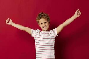 Cheerful boy in casual clothes posing emotion gesture with hands photo