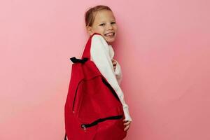 Portrait of happy smiling child girl kids style backpack school isolated background photo