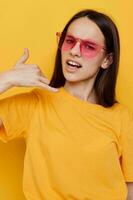 young woman in a yellow t-shirt emotions summer style isolated background photo