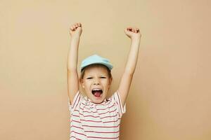 little girl in blue caps striped t-shirt emotions Lifestyle unaltered photo