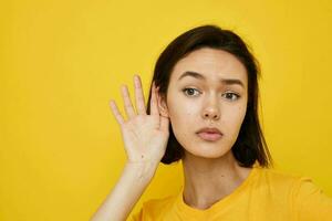 optimistic young woman in a yellow t-shirt Youth style casual Lifestyle unaltered photo