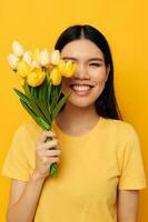 pretty brunette bouquet of flowers in hands spring fun posing studio model unaltered photo