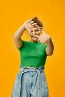 cheerful pretty girl in summer clothes posing yellow background photo