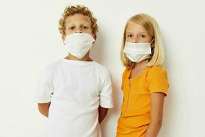 Cute stylish kids in medical mask protection posing grimace lifestyle unaltered photo