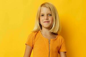 portrait of a little girl blonde straight hair posing smile fun isolated background unaltered photo