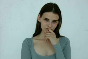 pretty girl in sweater posing studio isolated background photo