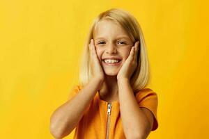 cute little girl with blond hair based childhood yellow background photo