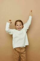 cute girl in white sweater posing hand gestures Lifestyle unaltered photo