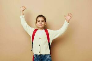 Portrait of happy smiling child girl schoolgirl backpack school childhood unaltered photo