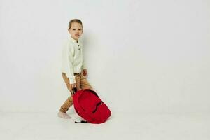 pretty young girl school red backpack posing isolated background photo