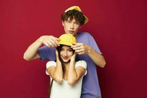 nice guy and girl in colorful t-shirts stylish clothes hats isolated background photo