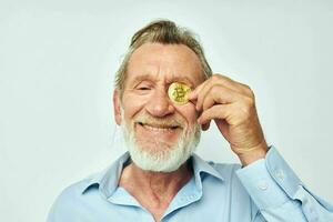 Photo of retired old man cryptocurrency bitcoin face close up investment light background